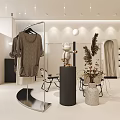Modern Clothing Store With Glass Window Display Mannequins Hanging Clothes Pendant Lights And Green Plants