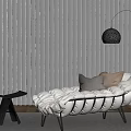 White Padded Chaise Lounge With Modern Floor Lamp Small Table And Window View