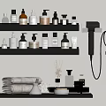 Bathroom Accessories Organized on Black Shelves With Toiletries Hair Dryer Towels and Aromatherapy Sticks