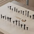 Various Hardware Tools Bolts Arranged On Wooden Tray With BULTEN Logo