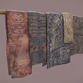 Colorful Scarves With Different Traditional Patterns Hanging On A Wooden Rod