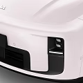 Sleek White Modern Electric Car With Black Roof Wheels And Futuristic Front Fascia Design