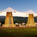 White Outdoor Tent With Wooden Support Structures Chairs Tables And Mountain View