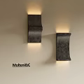 Modern Dark Metal Wall Sconces Mounted on Wall with Warm Glowing Light