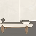 Light Upholstered Ottoman With Round Pillows And Wooden Legs In Minimalist Design