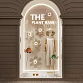 THE PLANT BASE Store Window Display With Flower Decor Dress Hat And Bags