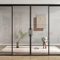 Modern Glass Sliding Doors In Interior With Rug Potted Plant And Wall Art
