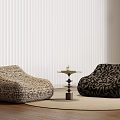 Two Patterned Single Sofas In Light And Dark Colors With Wooden Floor And White Blinds