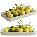 Fresh Lemons Arranged in Stone Tray with Green Leaves and Stems
