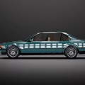 Green Classic BMW Sedan With Brown Interior Silver Wheels And Illuminated Headlights