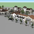 Mediterranean Style Commercial Street With Arched Windows Red Rooftops And Green Trees