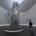 Airplane Models Arranged On Modern Sculpture In Exhibition Hall With Visitor Taking