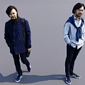 Two Men Posing in Dark Blue Coat Light Blue Shirt Scarf Backpack and Blue Sneakers