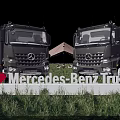 Two Mercedes Benz Functional Trucks Front View In Outdoor Grassland With Tents