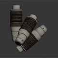 Three Industrial Cylindrical Components with Ribbed Metal Surface Red Top Indicators and Stacked Design