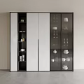 Modern Decorative Cabinet With Glass Doors And White Panels Displaying Tableware Cups Vases