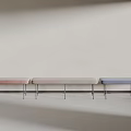 Modern Different Colored Benches In Pink Beige Blue With Metal Legs Against Light Wall