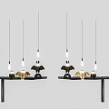 Decorative Ornament Set With Black Tables Gold Black Pieces And Hanging Bulbs