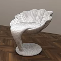 Modern Petal Shaped White Chair With Black Curved Base And Wooden Floor