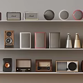 Collection of Various Vintage Radios Speakers and Horn Speakers Displayed on Three Shelves