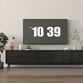 Modern Television on Black TV Stand with Drawers Green Plants and Floor Lamp