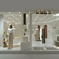 Clothing Store Front With Glass Window Mannequins Green Plants And Decorations