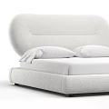 Elegant Modern Upholstered Double Bed With Curved Headboard And White Pillows