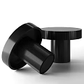 Modern Black Round Coffee Tables With Ribbed Cylindrical Bases And Sleek Surface Design