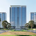 Modern High Rise Residential Complex With Glass Curtain Wall And Surrounding Trees And Lawn