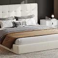 Modern Bedroom With White Tufted Headboard Gray White Pillows Brown Blanket Nightstand Lamp And Books