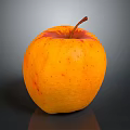 Fresh Ripe Orange Apple With Red Speckles And Stem On Dark Surface