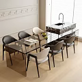 Modern Glass Top Dining Table With Black And White Chairs And Metal Legs