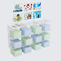 Storage Cabinet Shelf with Multiple Light Blue and Green Drawers and Decorative Pictures on Top