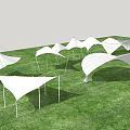 Modern Tensile Membrane Structures In Various Shapes On Green Grass Field