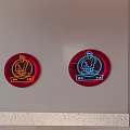 Modern Round Wall Decor With Red And Blue Lighting Figural Motifs Mounted On White Wall