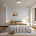 Modern Bedroom Interior With Striped Bedding Pillows Wall Art And Accent Chair