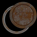Road Facility Rusty Circular Metal Cover With A.M.M.G Letters And Metal Ring
