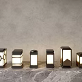 Various Modern Outdoor Lights With Different Designs On Stone Floor Against Concrete Wall