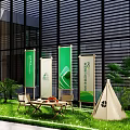 Outdoor Interactive Area With Green White Banner Flags Lawn Tables Chairs Tent And Green Plants