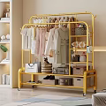 Gold Rolling Clothes Rack With Hanging Dresses Coats And Storage Bags Boxes