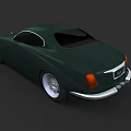 Dark Green Classic Coupe Car With Silver Accents And Alloy Wheels Design