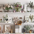 Stylish Decorative Ornament Combinations With Green Plants Dried Flowers Frames And Vases On Shelves