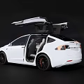 White Tesla Model X With Open Falcon Wing Doors On Dark Background