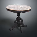 Vintage Marble Round Top Table With Dark Intricate Carved Legs And Classic Design