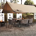 Cozy Camping Site With Beige Tent Table Chairs Fire Pit Bamboo Fence And Chinese Calligraphy Banners