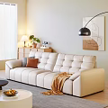 Beige Leather Three-Seater Sofa With Cushions Throw Blanket Floor Lamp And Abstract Art In Interior