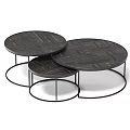 Set Of Three Round Coffee Tables With Black Metal Frames And Textured Surfaces