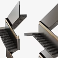 Modern Double Staircase Design With Dark Stone Steps And Gold Metal Handrail