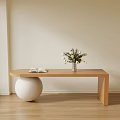 Wooden Shoe Bench With White Spherical Object Book And White Flowers On Wooden Floor