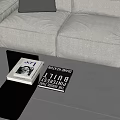 Light Sofa And Glass Top Coffee Table Set With Dark Pillow In Modern Living Room